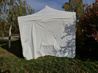 the plastic tent serves as a background for the celebration in the castle garden. preparatory...