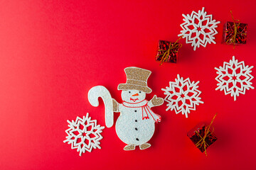 Christmas, snowman with Christmas presents, white snowflakes. Christmas background.