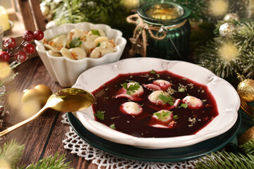 Traditional Christmas Eve red borscht with  dumplings filled with mushrooms and sauerkraut
