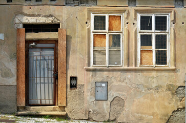 Fototapeta na wymiar Shabby wall and door on an old street in Prague