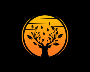 Deer head silhouette with sunset behind vector illustration logo