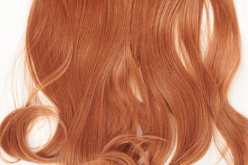 Fototapeta premium Natural looking shiny hair, red curls isolated on white background with copy space