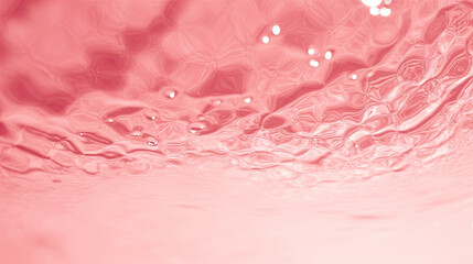 Transparent red liquid colored clear water surface texture with ripples, splashes and bubbles. Abstract nature background Water waves in sunlight with copy space , soft red water, soft pink water	

