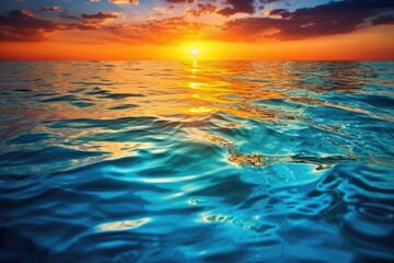 Obraz premium an aqua ocean reflecting a breathtaking sunset