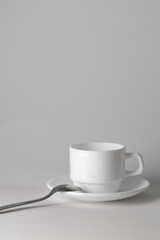 White ceramic coffee cup on a light background