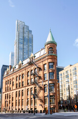 Fototapeta na wymiar New and old architecture at Toronto Downtown. Gooderham Building, known Flatiron Building
