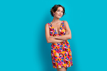 Photo of lovely woman with bob hair dressed colorful clothes arms folded look at promo empty space...