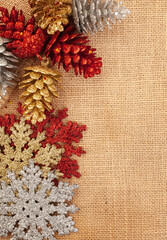 Glitter covered Christmas tree décor on rustic burlap