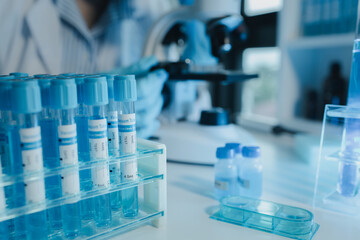 Chemist is chemically analyzing test tubes, Scientist is experimenting with chemicals in the...