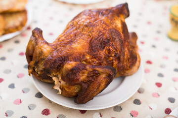 Whole roasted chicken on a plate