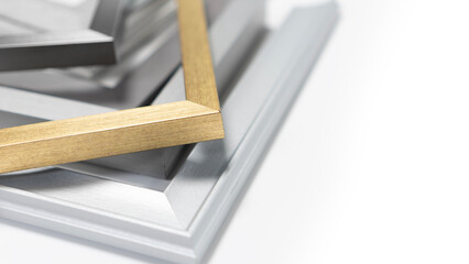 A pile of empty picture frames and mouldings on a clean white background