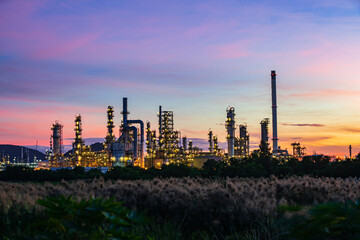 Fototapeta premium Oil​ refinery​ plant and tower of Petrochemistry industry in oil​ and​ gas​ ​industry with​ cloud​ blue​ ​sky