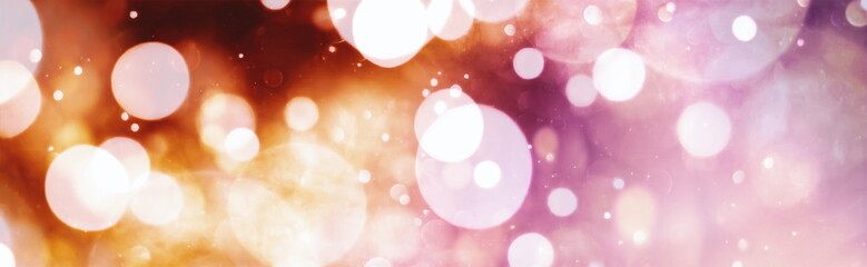 Abstract light celebration background with defocused golden lights for Christmas, New Year, Holiday