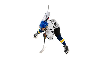 Fototapeta premium Top view image of young girl, hockey player in motion during game, training, playing isolated over white background. Concept of professional sport, competition, game, action, hobby