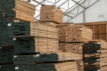 Stacks of lumber being stored in a warehouse