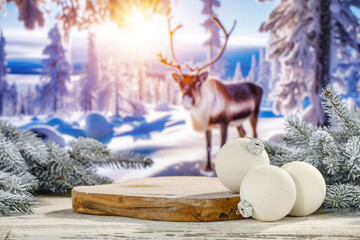 Desk of free space and green christmas tree cover of snow and frost. Winter landscape of forest and reindeers. 