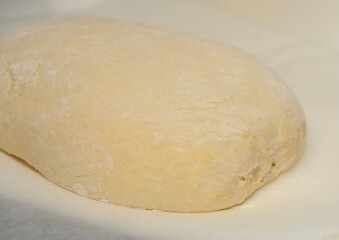 dough for homemade bread lies on the kitchen table before going into the oven 5