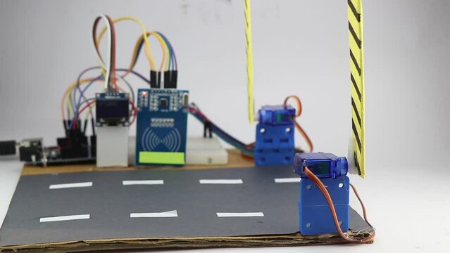 Automatic toll collection system working model made with electronic components like RFID module, OLED display, and Programmable controller