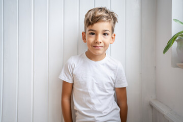 One boy caucasian child seven years old kid at home bright portrait