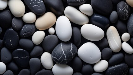 Black and white pebbles on the beach with water drop background.