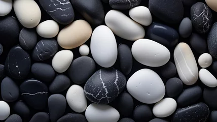 Photo sur Plexiglas Pierres dans le sable Black and white pebbles on the beach with water drop background.