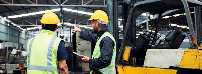 Engineer are working in the factory. Mechanical technicians are maintaining the engine. Worker with a forklift in a warehouse. © NewSaetiew