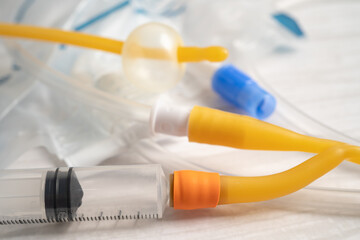 Foley urinary catheter with urine bag for disability or patient in hospital. - obrazy, fototapety, plakaty