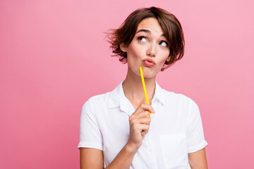 Portrait of student young girl creative art designer holding pencil to write her ideas minded look mockup isolated on pink color background