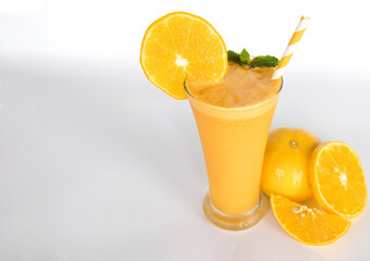 Orange smoothies yellow colorful fruit juice milkshake blend beverage healthy high protein the taste yummy In glass,drink to lose weight drink episode morning on white gray background.
