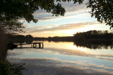 Idyllic lake scene with water reflection.