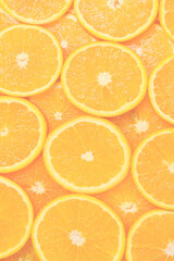 Slices of oranges as a background, top view.