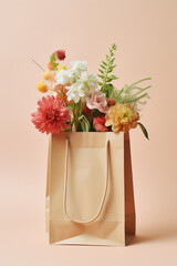 Shopping bag with flowers on pastel pink background