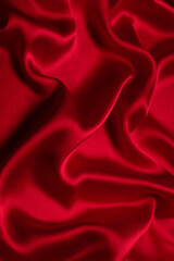 Obraz premium Red silk or satin luxury fabric texture can use as abstract background.