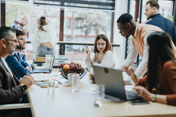 Business group collaborates in a corporate office, discussing market analysis, strategic planning, and financial statistics for global expansion and profit growth.