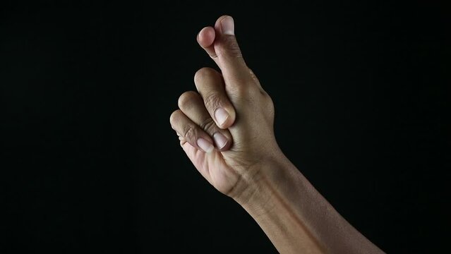 Close up of man's hand snapping her finger doing the hand gesture