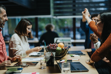 Businesspeople Collaborating on Project Development and Analyzing Data for Profitability
