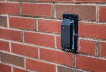 electronic key reader with glowing display, modern security concept in blurred background