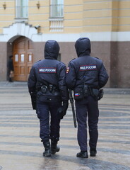 Two policemen on patrol in the city square, Palace Square, St. Petersburg, Russia, November 16, 2023
