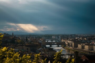 Fototapeta premium Aerial view of Florence from Piazza Michelangelo with a gathering rainstorm.