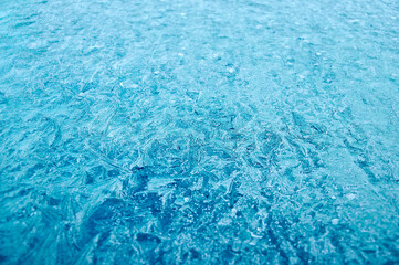 Winter frost patterns on the glass