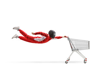 Racer in a red suit and black helmet flying with an empty shopping cart