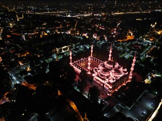 a view from the air at night of the mosque and city