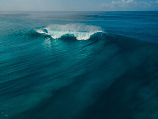 Perfect barrel wave in ocean. Aerial view of surfing swell