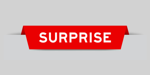 Red color inserted label with word surprise on gray background