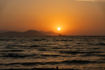 Fototapeta na wymiar Vibrant sunset over a sea horizon in Kos, Greece