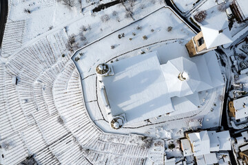 winter aerial view, with fresh snow of the sanctuary of the holy house in Tresivio in Valtellina, Italy