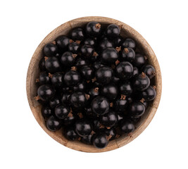 photograph of black currant berries in wooden round bowl isolated on white background with clipping path, top view
