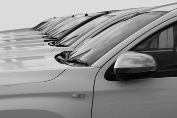 white SUV cars standing in a row. Fleet of generic modern cars. Transportation. Luxury OFFROAD car...