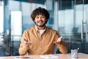 Webcam view, online video call, man smiling talking and gesturing looking at camera satisfied,...