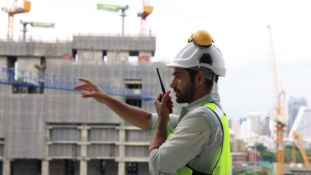 architect engineer using walkie-talkie command and control mega construction project